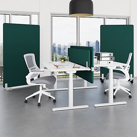 Office space with green dividers, white desks and chairs. Large windows overlooking a city.