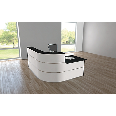 Modern white reception desk with black surface, office chair in front. Bright room with wooden floor and window.