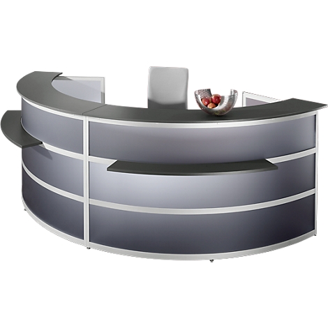 A semi-circular reception desk in grey with silver accents. On the counter is a fruit bowl.