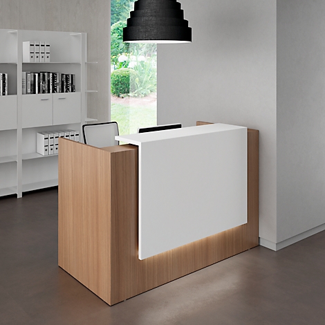 Reception desk with white front and wood paneling. A black lamp hangs above.
