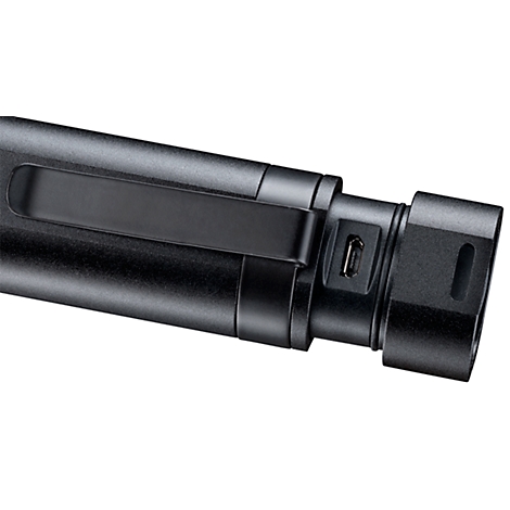 Close-up of a black flashlight with USB port and clip.