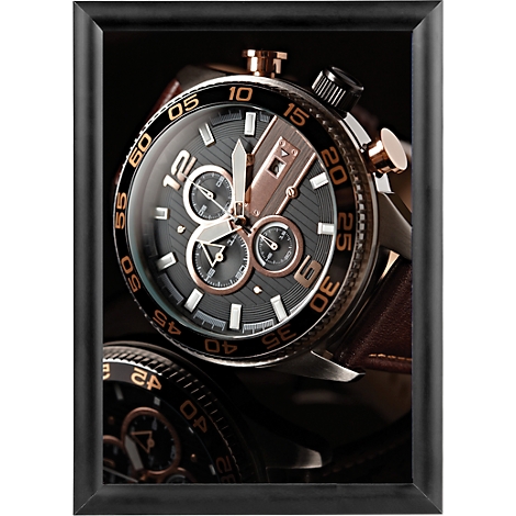 Close-up of a luxury wristwatch with a black dial, gold accents, and a leather strap.