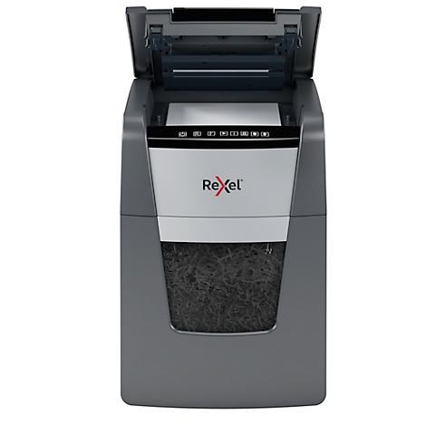 Shredder, gray and black. Opened at the top with paper, shredded paper visible below, Rexel logo.