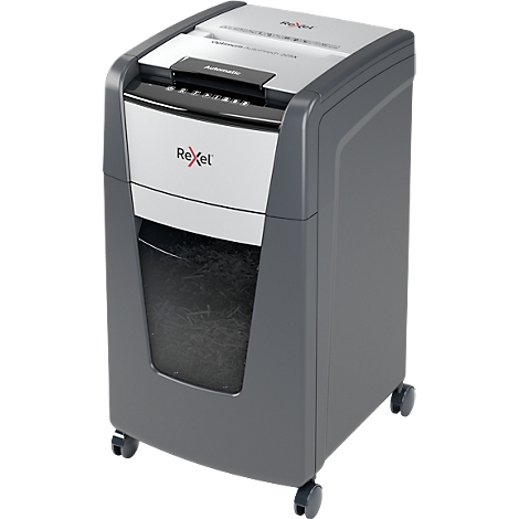 A gray and white paper shredder. The device has a paper feed at the top and a collection container with shredded paper.