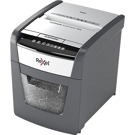 Gray paper shredder with white top, 'Rexel' lettering, shredded paper visible.