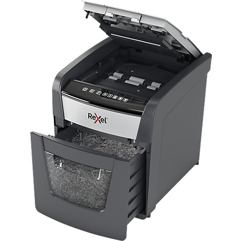 Gray paper shredder with open flap and pulled-out collection drawer. Inside are shredded paper strips.