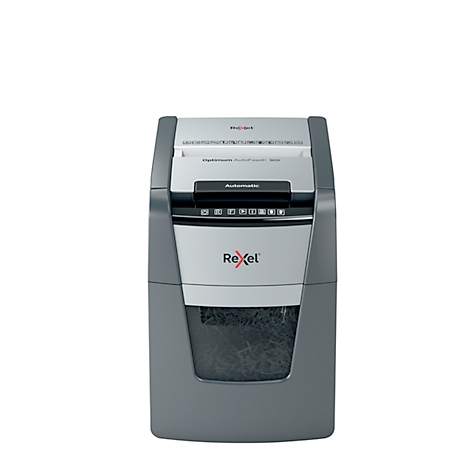 Grey paper shredder with "Rexel" logo. Above, paper feed; below, a container with shredded papers.