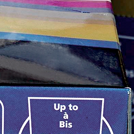 Close-up of an edge with the text "Up to à Bis" in white on a blue background. Above are layers of color.
