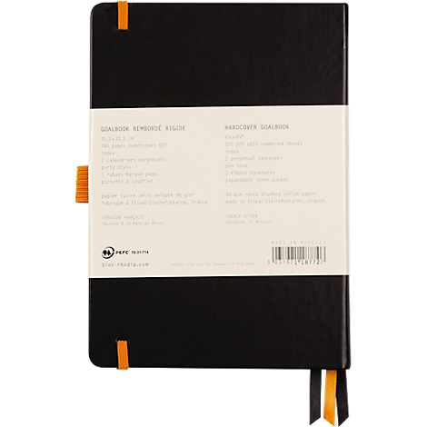 Carnet noir avec bande de papier beige. Texte: 'Goalbook Xlimbound Rigid'. Signets orange.