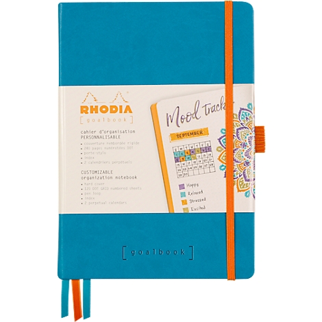 Carnet turquoise avec élastique orange et un calendrier de suivi de l'humeur.