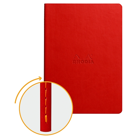 Rotes Notizbuch mit Prägung; Vergrösserung zeigt orangefarbene Heftung.