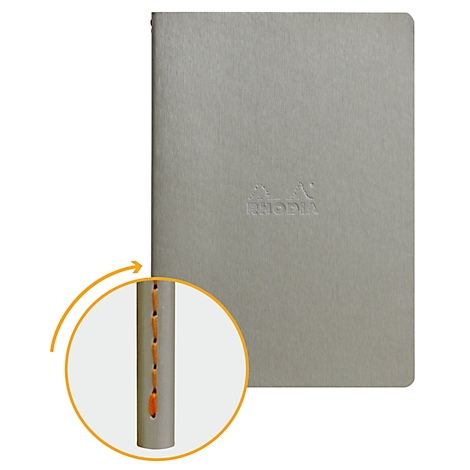 Graues Notizbuch mit geprägtem Logo. Im Detail: Naht in orange. Aufschrift 'RHODIA'.
