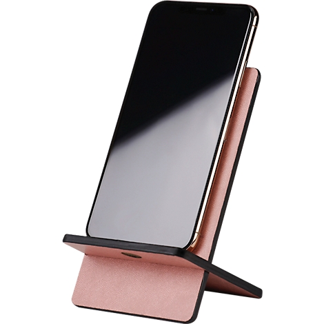 Smartphone in a pink and black stand. The screen is black and reflecting. The stand has a curved shape.