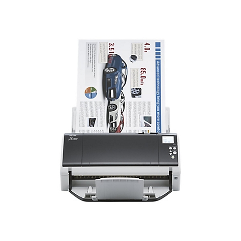 Un scanner à plat Ricoh numérise une page contenant des informations sur les voitures.