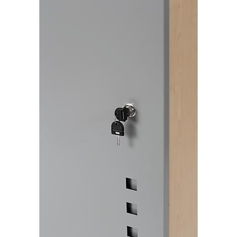 Grey cabinet, keys in the lock, other keys hanging next to it.