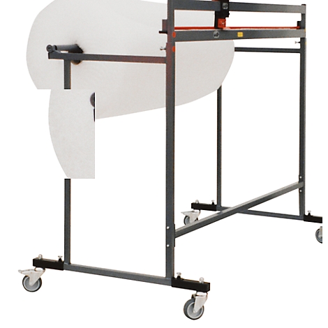 Gray paper roll holder with a white paper roll, on wheels. A gray cutter is on the top.