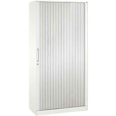 White cabinet with a ribbed front and handle. Vertical lines dominate the design. A minimalist piece of furniture.