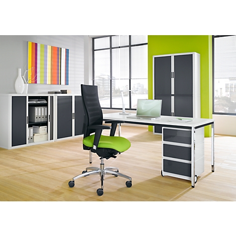 Office space with a modern desk, chair, wall unit, and colorful artwork. Bright ambiance, plenty of daylight.