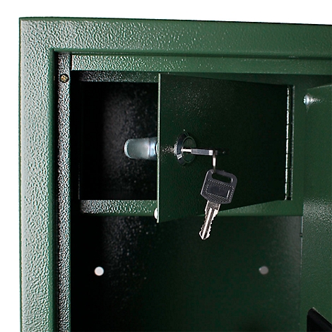 Close-up of a green safe door with key in the lock. The door is open, a part of the interior is visible.