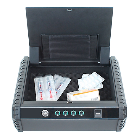 Open black safe containing medication. Inside are syringes, tablets, and a medicine package.