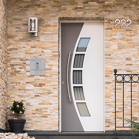 Modern front door, partly grey, partly white. On the wall are a house number 222, a lamp and a mailbox.