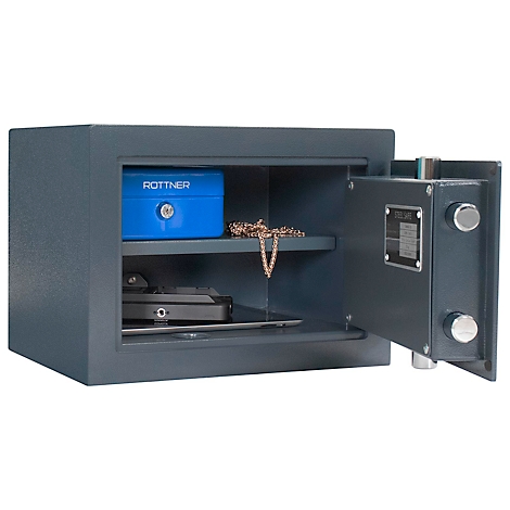 Grey safe with open door, filled with jewelry and a blue box. There is a sign on the door.
