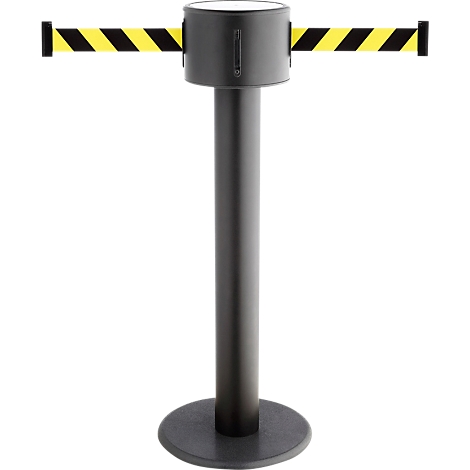 A retractable belt stanchion with yellow and black striped bands. On a black base with a dark post and top housing.