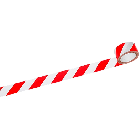Ruban de signalisation rouge et blanc, rayé en diagonale, avec un rouleau en arrière-plan.
