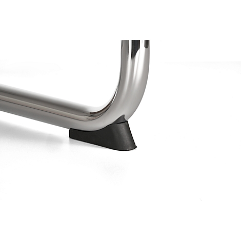 Close-up: curved metal foot with black rubber buffer.