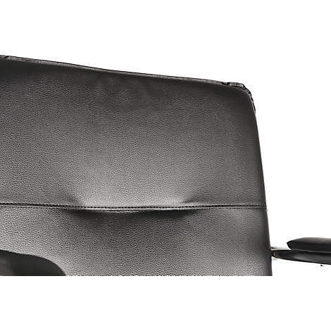 Close-up of a black office chair: the leather backrest with a horizontal seam.