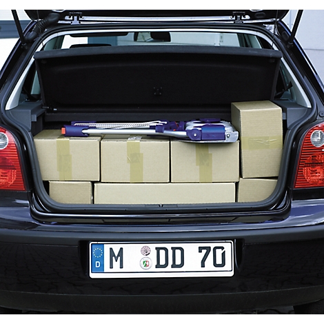 Open trunk of a black car, packed with boxes and an item.