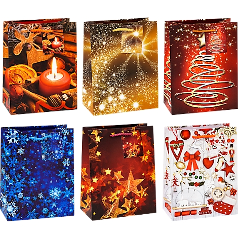 Six sacs cadeaux aux motifs de Noël. Étoiles, flocons de neige, sapin de Noël et décorations de cadeaux.