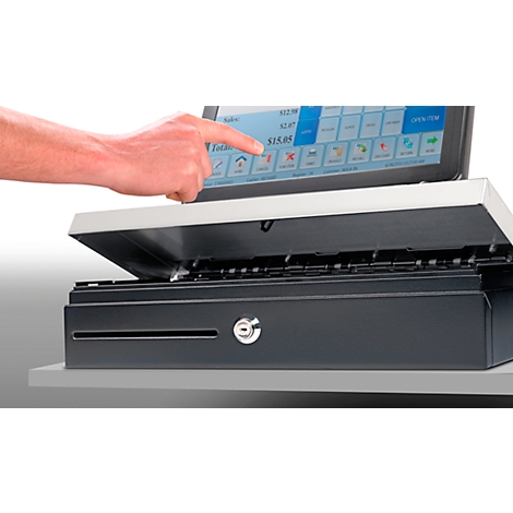 A hand touches the screen of a cash register. The screen displays numbers and symbols. Below is a drawer.