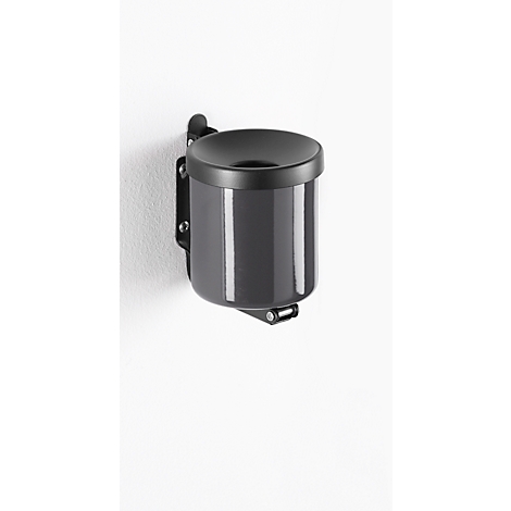 Grey wall-mounted ashtray. Cylindrical with lid and bracket, on white wall.