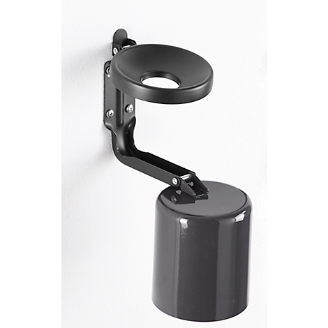 Black wall-mounted holder with cup and cover, attached to a white wall.