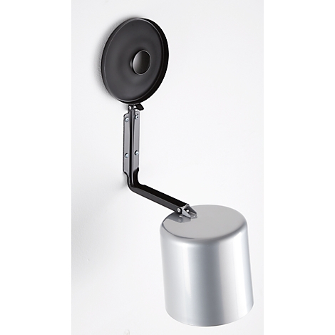 Metal container on wall, silver cylinder with black lid and arm.