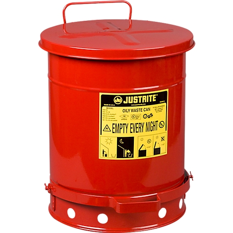 Red oil drum waste can with yellow label. Marked "JUSTRITE" and "EMPTY EVERY NIGHT".