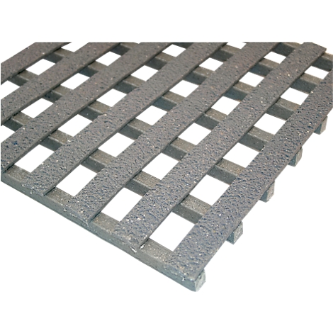 Grey plastic mat with a grid pattern. The mat has a rough surface and is photographed diagonally from above.
