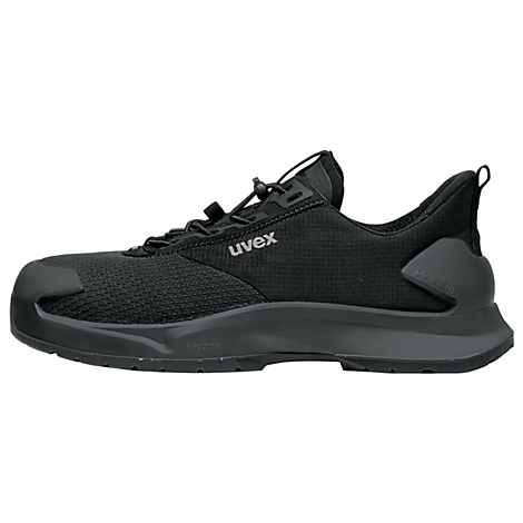 Black Uvex safety shoe, side view. Laces, toe protection and sole stand out.