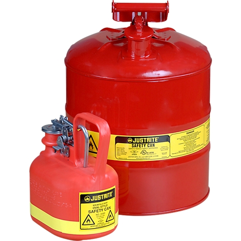 Two red safety cans with yellow labels and warning signs, standing side by side.