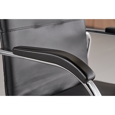 Close-up of an office chair armrest. Black, padded armrest on chrome metal.