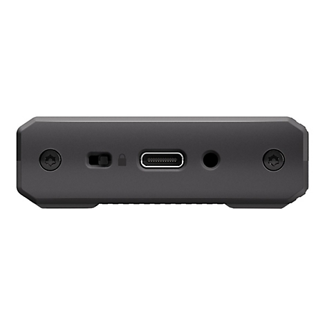 Gros plan d'un appareil noir et rectangulaire avec un port USB-C, un interrupteur d'alimentation et une prise casque.