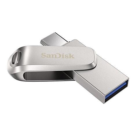 Clé USB SanDisk argentée. Photographie sur fond blanc.