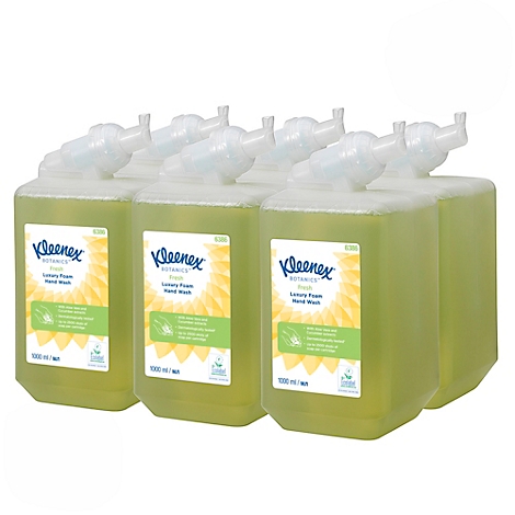Plusieurs contenants de lavage des mains Kleenex côte à côte ; liquide jaune, distributeur blanc, étiquette tournesol.