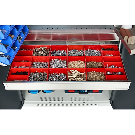 Armoire à outils avec tiroirs rouges remplis de diverses vis et petites pièces.