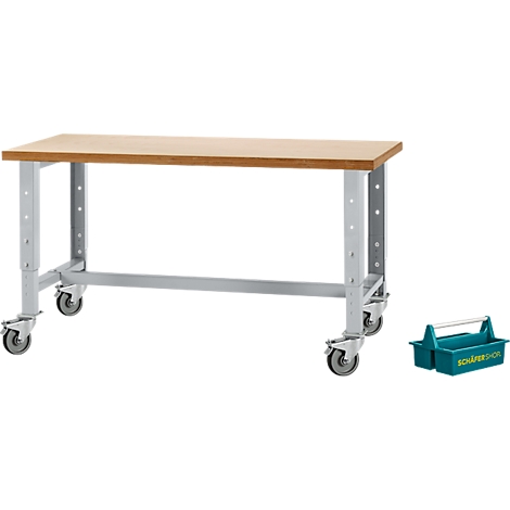 Établi avec plateau en bois, pieds en acier gris et roues. Une boîte à outils bleue à droite. Vue oblique.