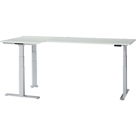 A white, height-adjustable corner desk on a gray background. The table has a control panel for height adjustment.