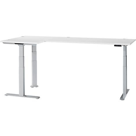 A white L-shaped height-adjustable desk on a grey base. Controls are on the right.