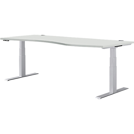 Un bureau blanc réglable en hauteur avec un plateau incurvé et des pieds argentés.