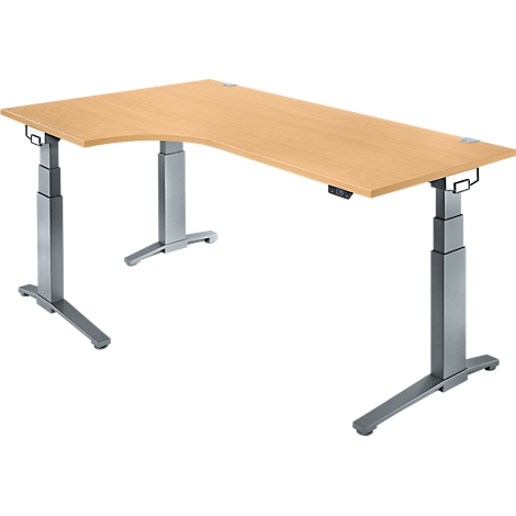 Un bureau d'angle réglable en hauteur, en bois clair avec un cadre en métal gris, vue plongeante.